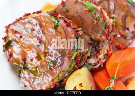 Stewed mutton with spices on a white plate Stock Photo