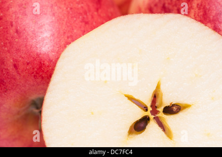 Closeup of a gala apple slice in the front Stock Photo