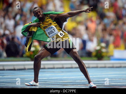 Moscow, Russia. 11th Aug, 2013. Usain Bolt of Jamaica celebrates after winning the men's 100m final at the 14th IAAF World Championships at Luzhniki stadium in Moscow, Russia, 11 August 2013. Photo: Bernd Thissen/dpa/Alamy Live News Stock Photo