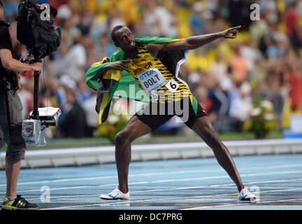 Moscow, Russia. 11th Aug, 2013. Usain Bolt of Jamaica celebrates after winning the men's 100m final at the 14th IAAF World Championships at Luzhniki stadium in Moscow, Russia, 11 August 2013. Photo: Bernd Thissen/dpa/Alamy Live News Stock Photo