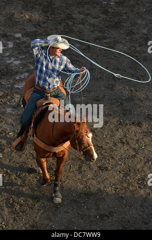 Cowboy practicing roping before the Chief Joseph Days Rodeo in Joseph, Oregon. Stock Photo