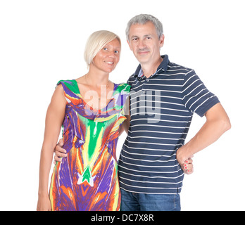 Smiling attractive middle-aged couple standing close together looking at the camera isolated on white Stock Photo