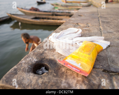 Naga Sadhu holy man bathing at dawn with Bibhuti ash on the banks of the Ganges River - Varanasi, India Stock Photo