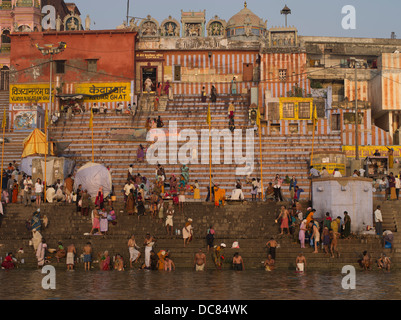 Bathing and Purification in the Ganges River at dawn - Varanasi, India. Studies have reported high pollution - fecal coliform Stock Photo