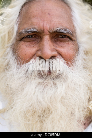 Portrait of elderly Indian man with large white beard and mustache in Varanasi India Stock Photo