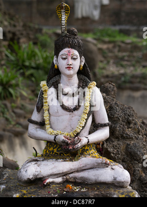 Statue of Lord Shiva, Hindu Deity - Life on the banks of the Ganges River - Varanasi, India Stock Photo
