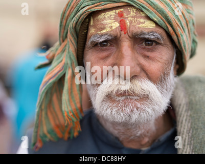 Portrait of Saivite pilgrim who had  traveled to the Ganges River ( Varanasi ) for Kumbh Mela in March 2013. Stock Photo