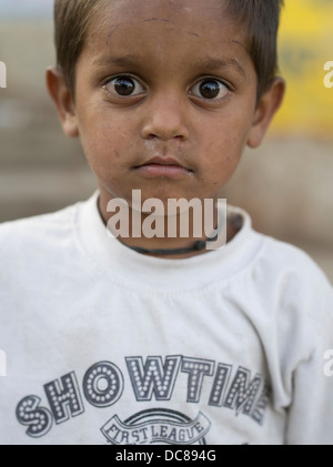 Portrait of young boy living on the streets by the Ganges River ( Varanasi ) Stock Photo