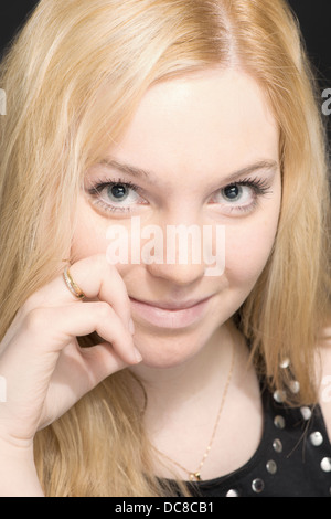 Portrait of happy young blond female teenager Stock Photo
