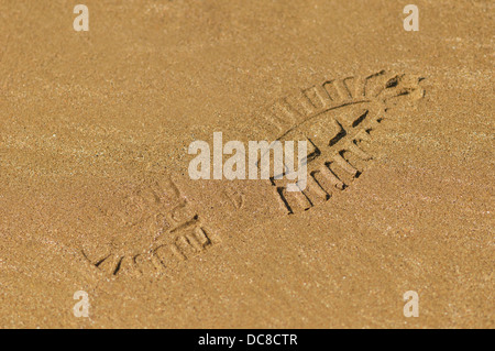 Boot footprint on the sand Stock Photo