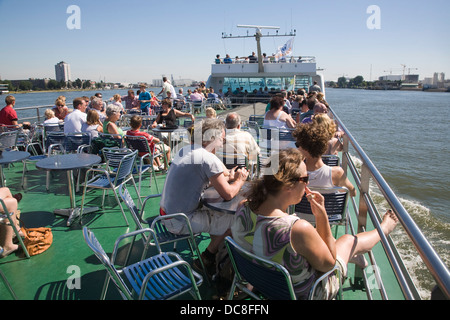 Passengers on deck enjoying sunshine on Spido boat trip Rotterdam Netherlands Stock Photo