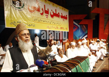 Jamat-e-Islami (JI) Ameer, Syed Munawar Hassan addresses to his supporters during Eid-Millan Party held at local hall in Peshawar on Monday, August 12, 2013. Stock Photo