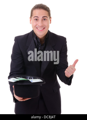 Paper money cash in euro from a hat demonstrated by man in black suit. Isolated on white. Stock Photo