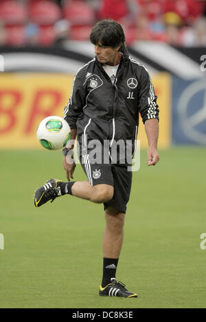 Mainz, Germany. 12th Aug, 2013. Germany's national soccer coach Joachim Loew juggles the ball during the public training of the German national soccer team at Coface Arena in Mainz, Germany, 12 August 2013. Photo: FREDRIK VON ERICHSEN/dpa/Alamy Live News Stock Photo