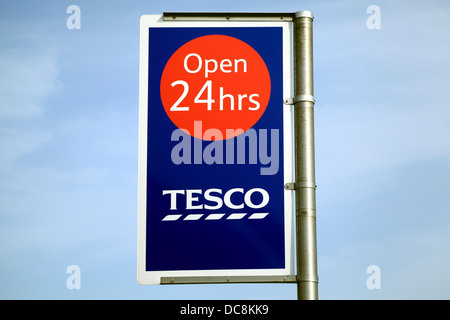 Tesco Supermarket, open 24 hours sign, England UK English supermarkets Stock Photo