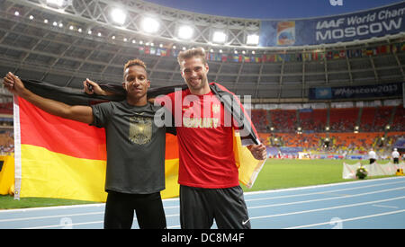 Moscow, Russia. 12th Aug, 2013. Germany's Raphael Holzdeppe (L) celebrates with third placed Bjoern Otto Of Germany after winning the the men's Pole Vault Event at the 14th IAAF World Championships in Athletics at Luzhniki Stadium in Moscow, Russia, 12 August 2013. Photo: Michael Kappeler/dpa/Alamy Live News Stock Photo