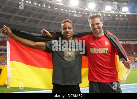 Moscow, Russia. 12th Aug, 2013. Germany's Raphael Holzdeppe (L) celebrates with third placed Bjoern Otto Of Germany after winning the the men's Pole Vault Event at the 14th IAAF World Championships in Athletics at Luzhniki Stadium in Moscow, Russia, 12 August 2013. Photo: Michael Kappeler/dpa/Alamy Live News Stock Photo