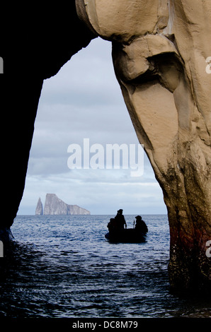Ecuador, Galapagos. View of Kicker Rock (aka Leon Dormido) through a cave from San Cristobal. Stock Photo
