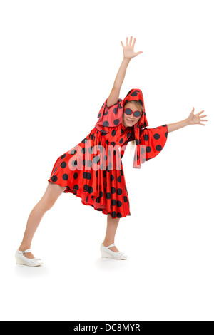 teen girl dancing in a red polka-dot dress with sunglasses. Isolate on white background Stock Photo