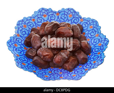 dried dates on iranian plate isolated on white background Stock Photo