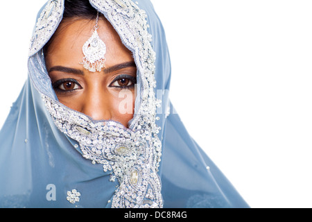 traditional Indian woman in sari covering her face with veil Stock Photo