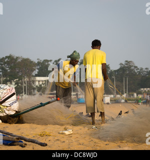 CHENAI, INDIA - FEBRUARY 10: Indian fisherman on the Marina beach at morning Stock Photo