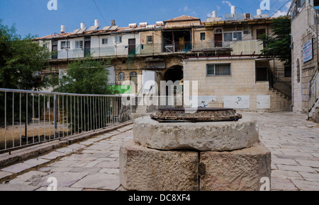 Jerusalem, Israel. a well and an early 20th-century housing complex in the 'Shaarei Hesed' (Gates of grace) neighborhood. Stock Photo