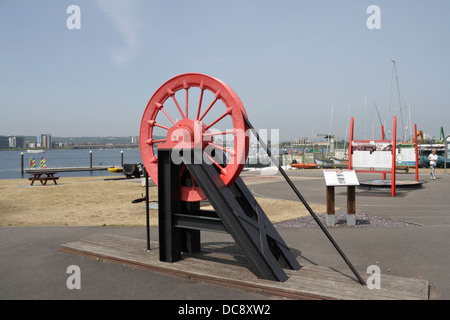 Age of Coal - Pithead wheel / Cardiff Bay barrage Wales, celebration of the coal mining industry Stock Photo