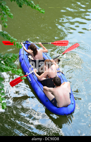 Young group with dog kayaking on River Thames, Pangbourne, Berkshire, England. United Kingdom Stock Photo