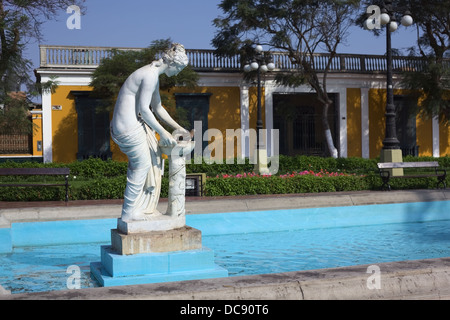 The statue of Danaide with a pigeon in the fountain of the Parque Municipal in the district of Barranco, Lima, Peru Stock Photo