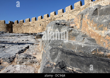 basalt rock outcrop fortified by Crusaders. Acropolis and fort above Lindos, Rhodes, Greece. Stock Photo