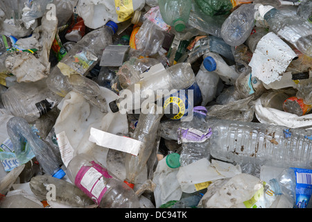 Piles of plastic bottles and other plastic rubbish at a waste recycling plant in the West Midlands. Stock Photo