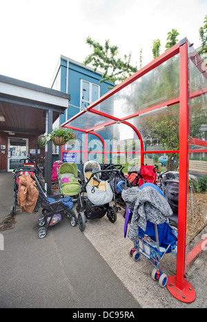 A buggy park at St. Pauls Nursery School and Children's Centre, Bristol UK Stock Photo