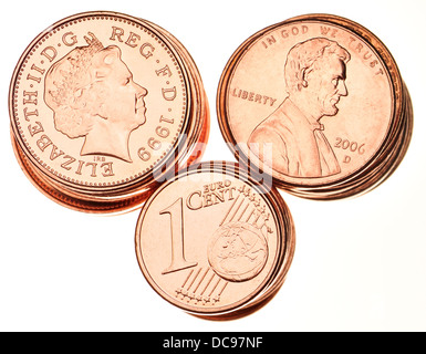 British pennies; American 1c pieces; Euro 1c pieces. Stock Photo