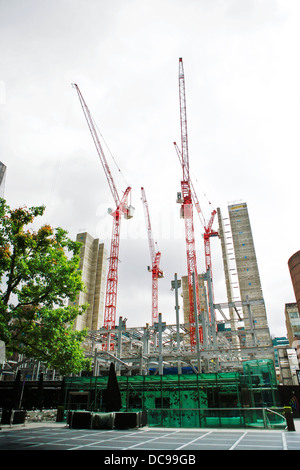 Construction cranes / partially completed lift shafts of UBS new offices at 5 Broadgate in Central London Stock Photo
