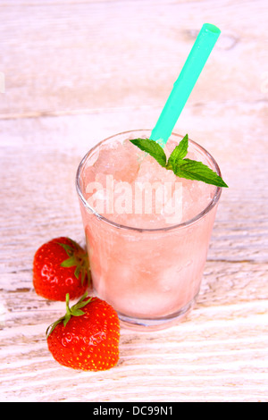 Strawberry slush in glass with straw and mint, top view Stock Photo