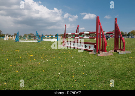 Jumping barriers at Suffolk Horse Show jumping competition. Ipswich Showgrounds, Suffolk, UK. Stock Photo