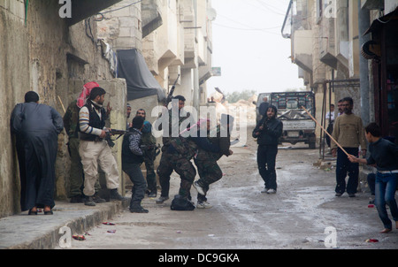 Free Syrian Army fighting groups clash on the streets of Aleppo. Stock Photo