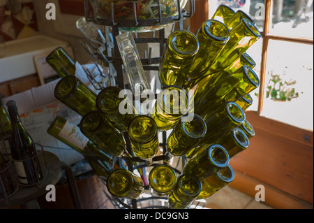 A rack full of empty wine bottles in a wine shop in L'Isle-sur-la-Sorgue Stock Photo