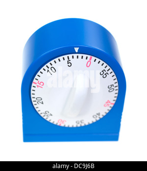 A blue kitchen timer with the dial showing three minutes to go on a white background. Stock Photo
