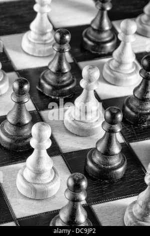 Chess pawns on the chessboard, black and white photo Stock Photo