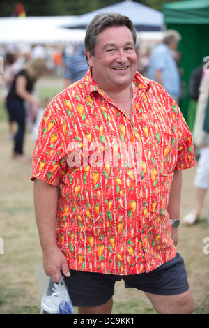Man dressed in chilli shirt at the Chilli Fiesta weekend, West Dean College, near Chichester, West Sussex, England, UK Stock Photo