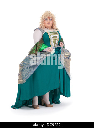 Overweight drag queen in vintage dress and pretty curly blond wig accentuating his weight with Victorian bustles Stock Photo