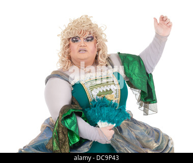 Overweight drag queen in vintage dress and pretty curly blond wig accentuating his weight with Victorian bustles Stock Photo