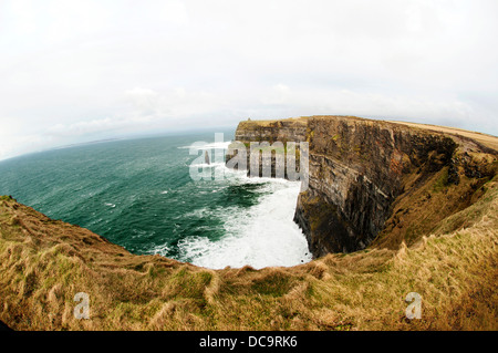 The Cliffs of Moher are located at the southwestern edge of the Burren region in County Clare, Ireland. Stock Photo