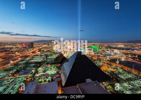 Louxor Casino and Hotel and Las Vegas skyline at the blue hour as seen from the Mix Lounge terrace at THEhotel, Las Vegas,Nevada Stock Photo