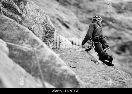 Low view on alpinist on the rock cliff. 'Mon coeur espagnol' route on Petit Jorasses face in French Alps. Haute-Savoie. France. Western Europe. Stock Photo