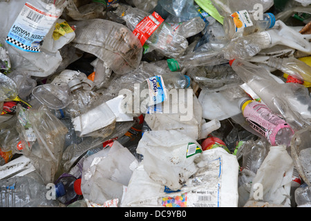 Piles of plastic bottles and other plastic rubbish at a waste recycling plant in the West Midlands. Stock Photo