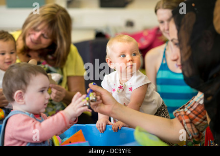 A baby at St. Pauls Nursery School and Children's Centre, Bristol UK Stock Photo