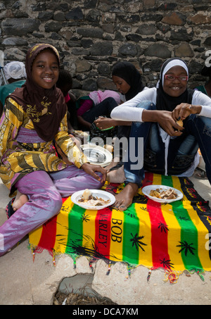 Muslim Senegalese Schoolgirls Visiting Goree for the Day, Goree Island, Senegal. Lunch time. Stock Photo